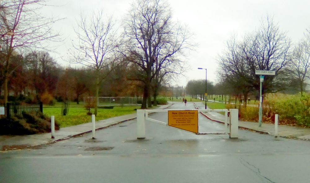 The closed off road with sign indicating its permanent removal, December 2017